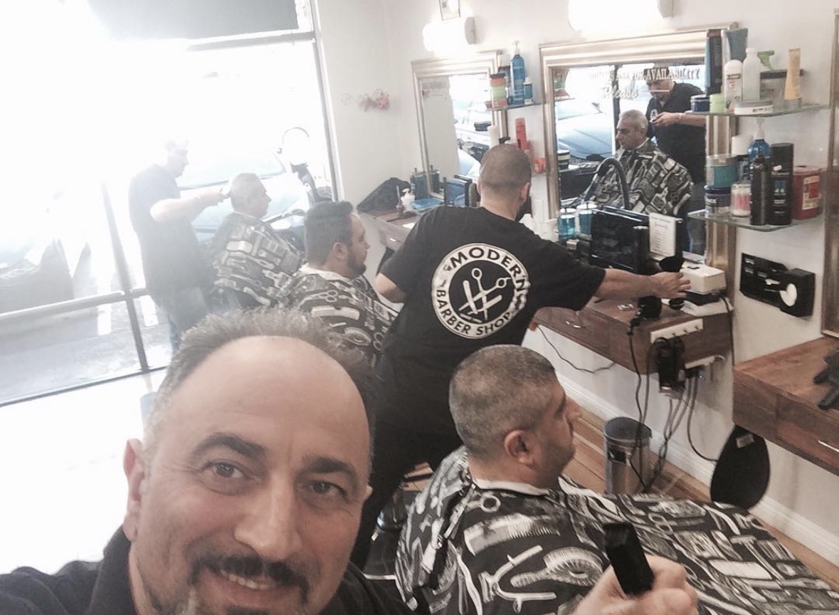 Barbers at work — busy day inside Modern Barber Shop