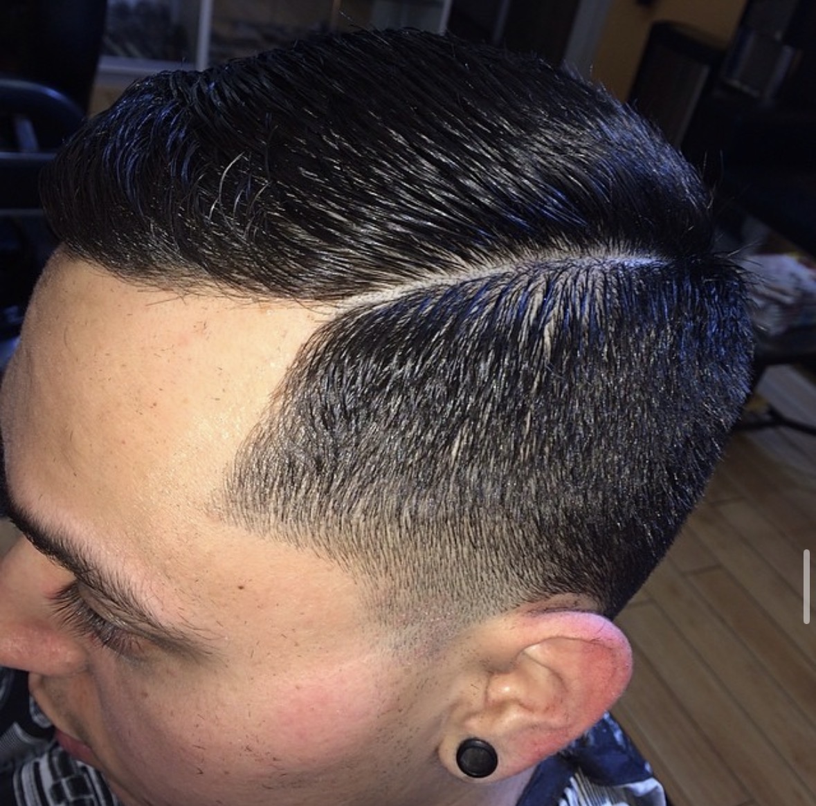 Hard part comb-over with skin fade