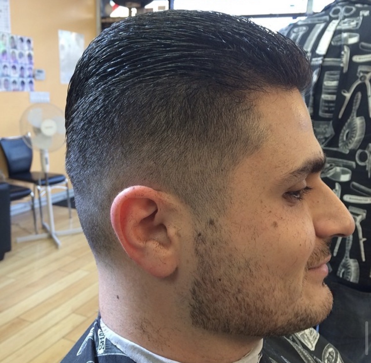 Classic pompadour with high fade and beard blend