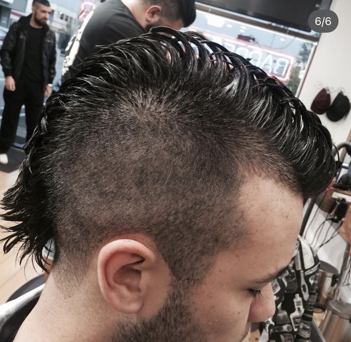 Textured mullet-style cut with skin fade sides