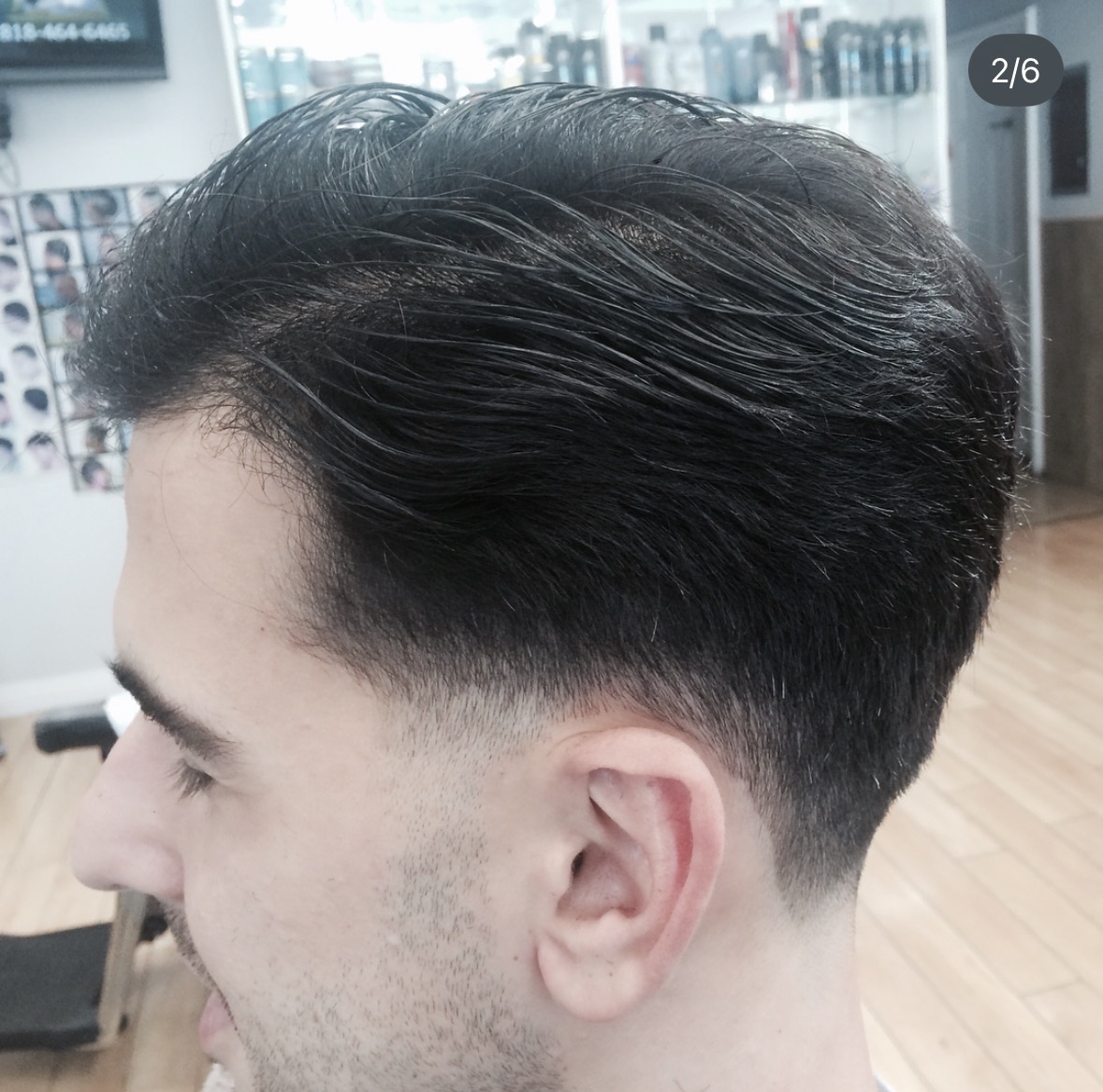 Men's brush-back haircut with tapered sides